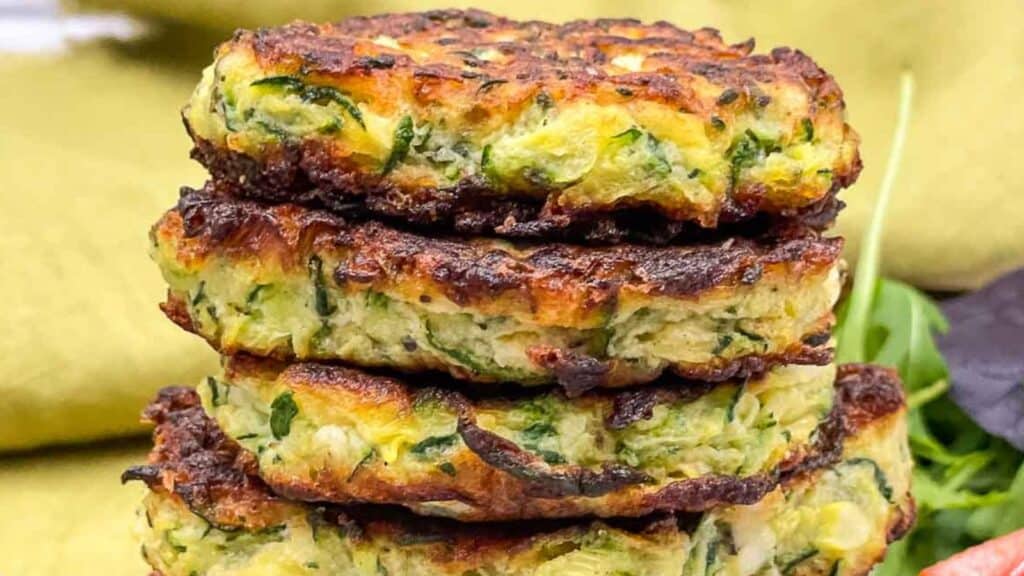 Zucchini fritters in a stack.