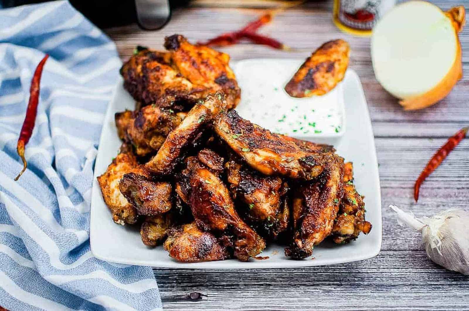 Air fryer bbq wings on a white plate.