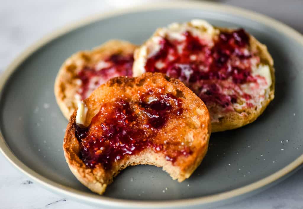 Air fryer english muffins on a blue plate.