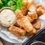 Air fryer fish sticks with remoulade dipping sauce.