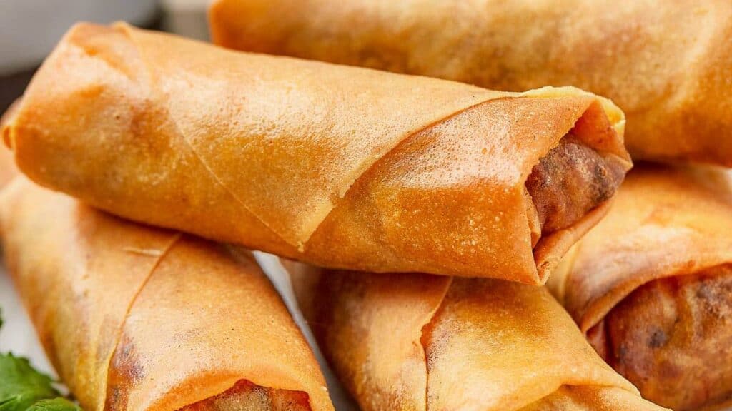 Closeup of crispy spring rolls cooked in air fryer.
