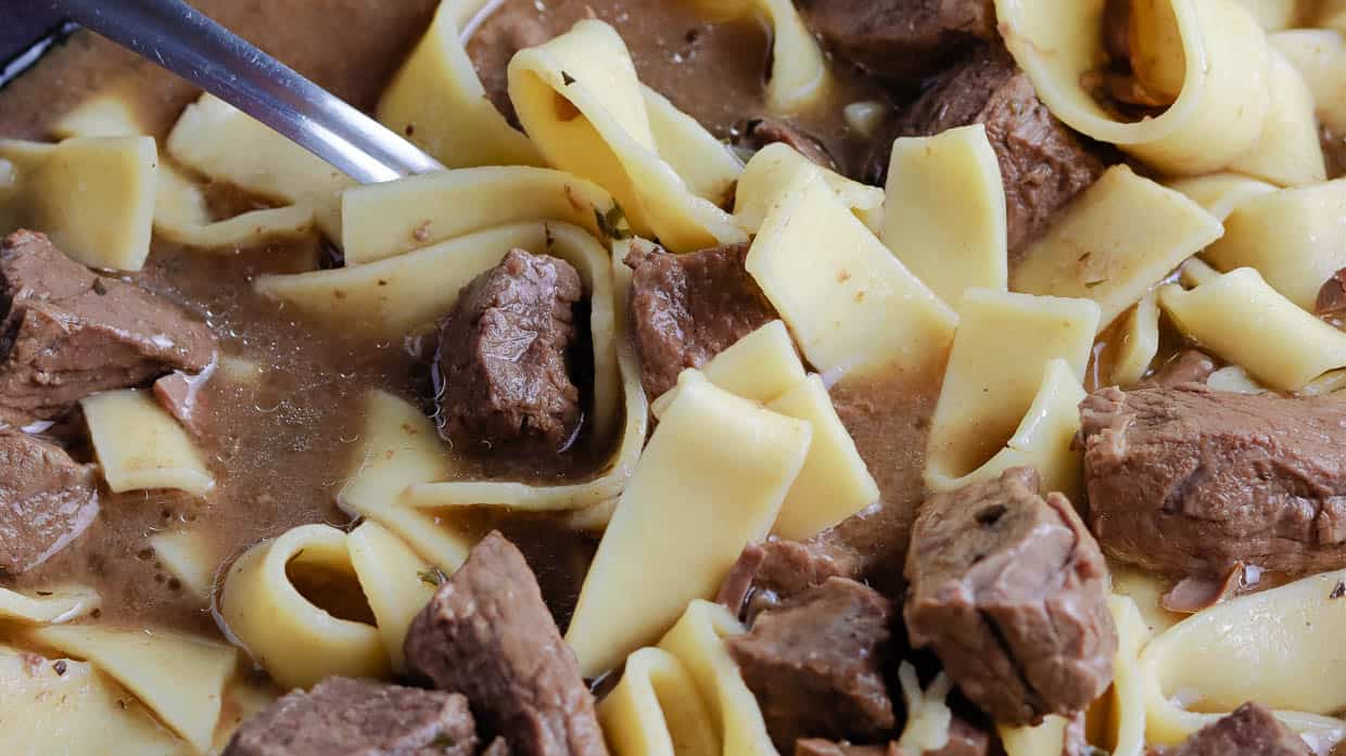 Closeup of Slow Cooker beef with egg noodles.