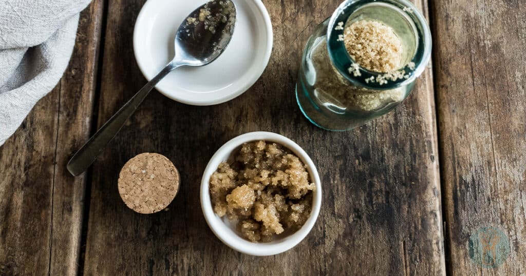 brown sugar lip scrub recipe in white bowl from above with spoon