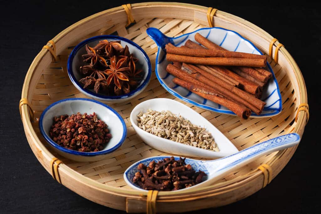 The spices for Chinese 5 spice powder: cinnamon, cumin, star anise, szechuan peppercorn, clove.
