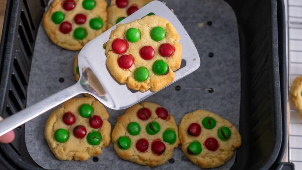 Cookie with red and green M&Ms coming out of the air fryer.