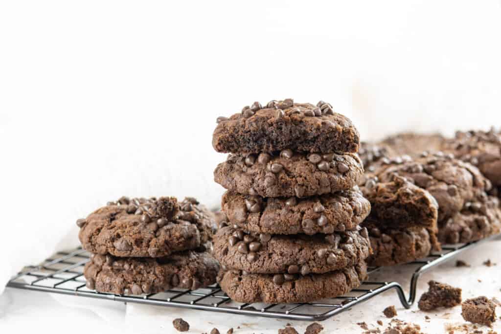 stacks of chocolate cookies on a cooling rack.