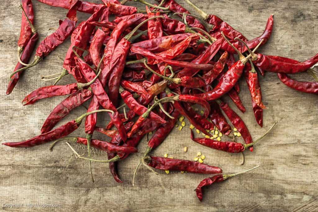 A pile of dried red chile peppers.
