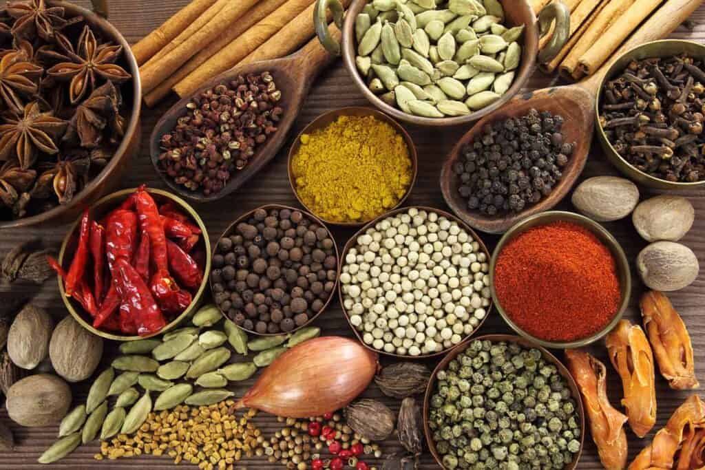 Overhead shot of many Indian spices.