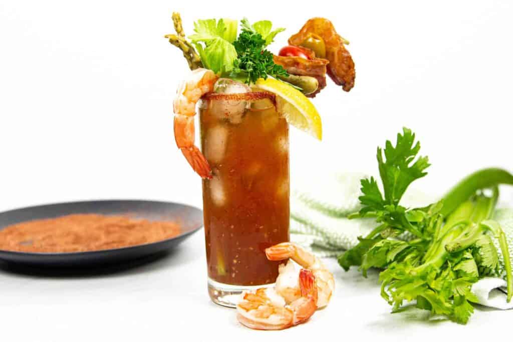 shrimp, celery and asparagus garnish a new orleans Bloody Mary.
