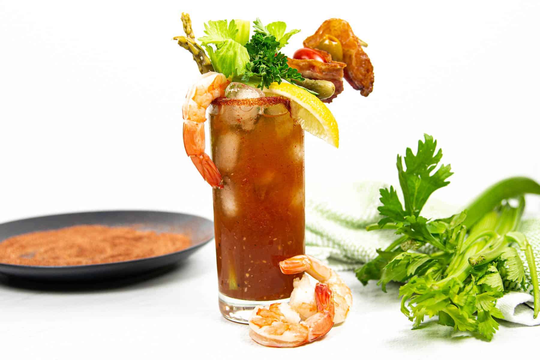 Sshrimp, celery and asparagus garnish a new orleans Bloody Mary.