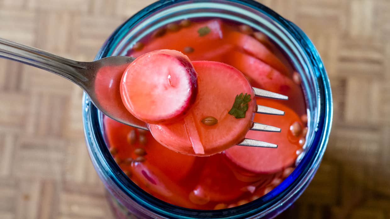 Quick pickle recipe using radishes and a jar.