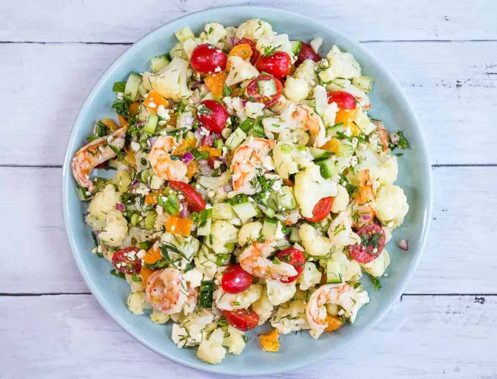 A closeup of Shrimp & Cauliflower Salad in a serving bowl.