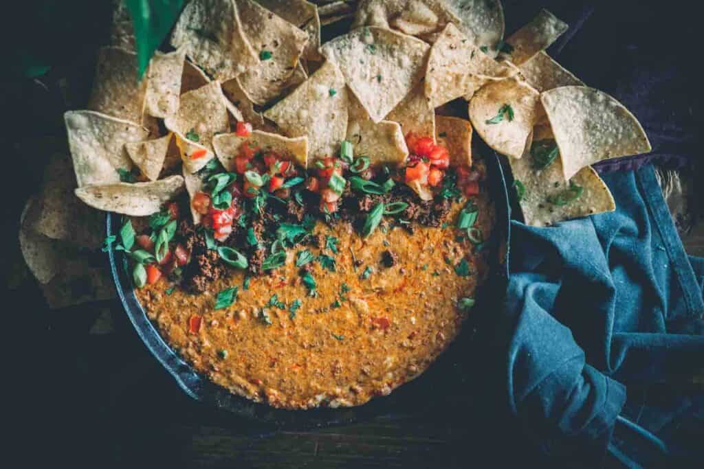 Skillet filled with chorizo and queso.