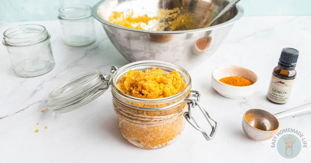 turmeric body scrub with mixing bowl in background ingredients alongside