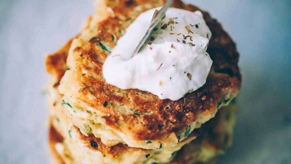 Close shot of a stack of zucchini fritters.