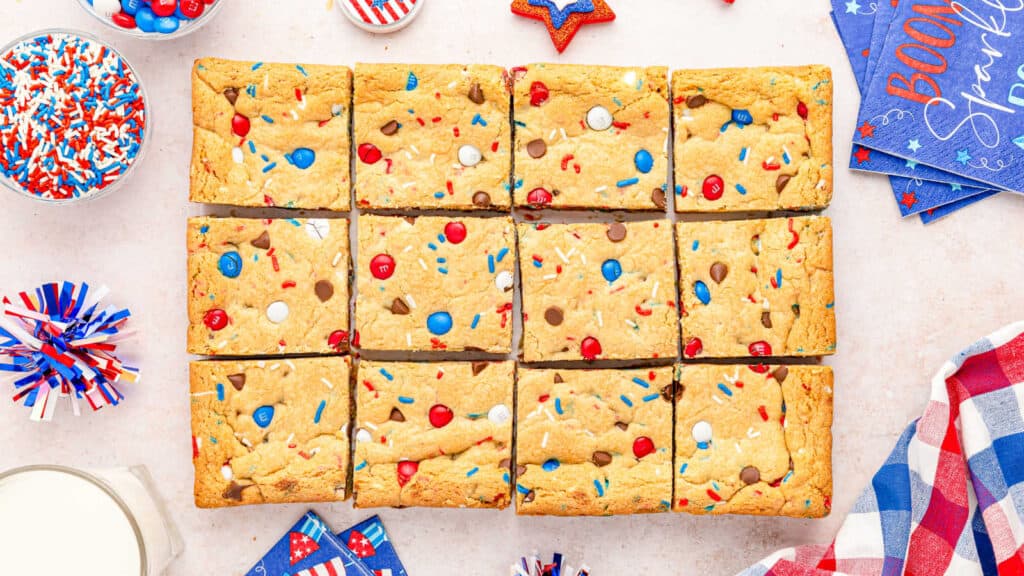 Red, white and blue cookie bars cut into squares.