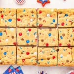 Red, white and blue cookie bars cut into squares.
