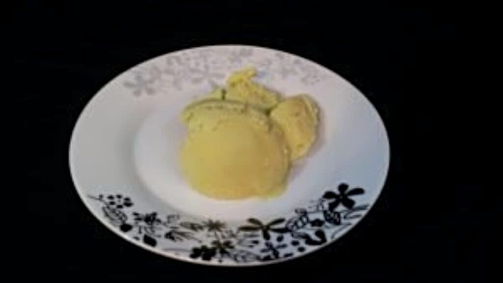 Avocado ice cream on a plate.