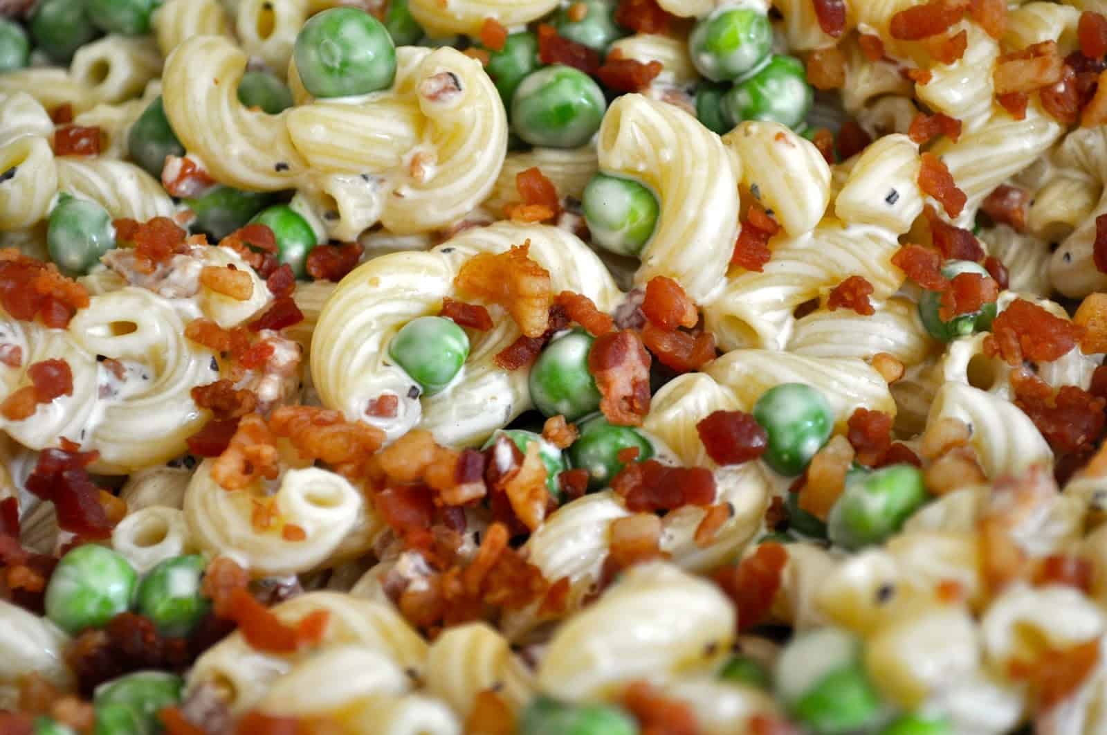 Bacon ranch macaroni salad with peas, bacon, and a ranch dressing.