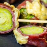 Bacon Wrapped Brussels Sprouts cut into half.