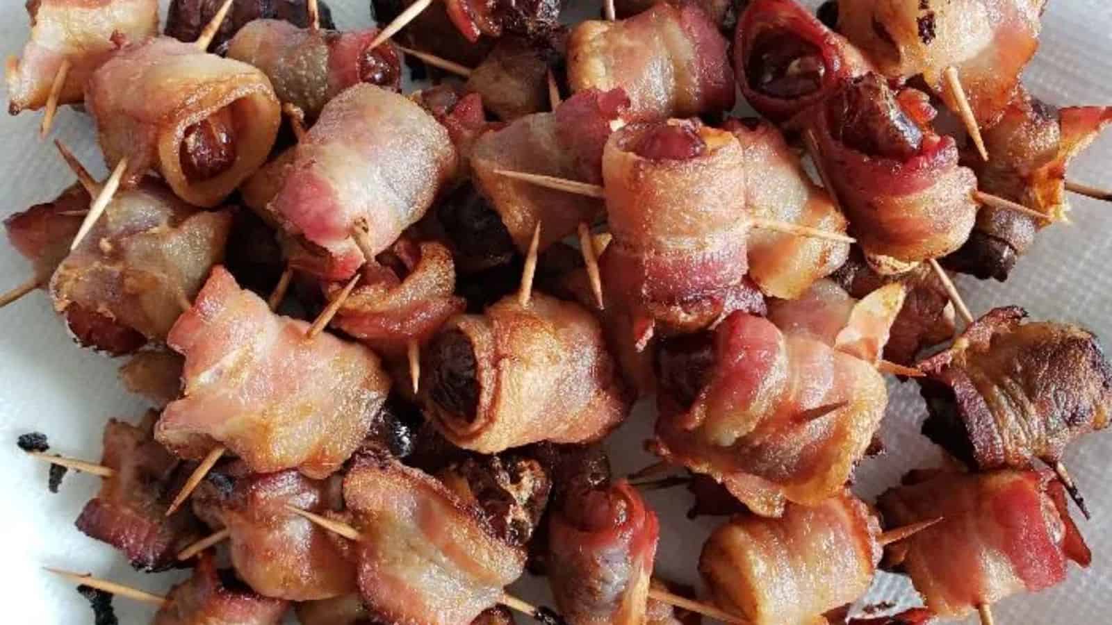 Image shows an overhead shot closeup of Bacon Wrapped Dates.