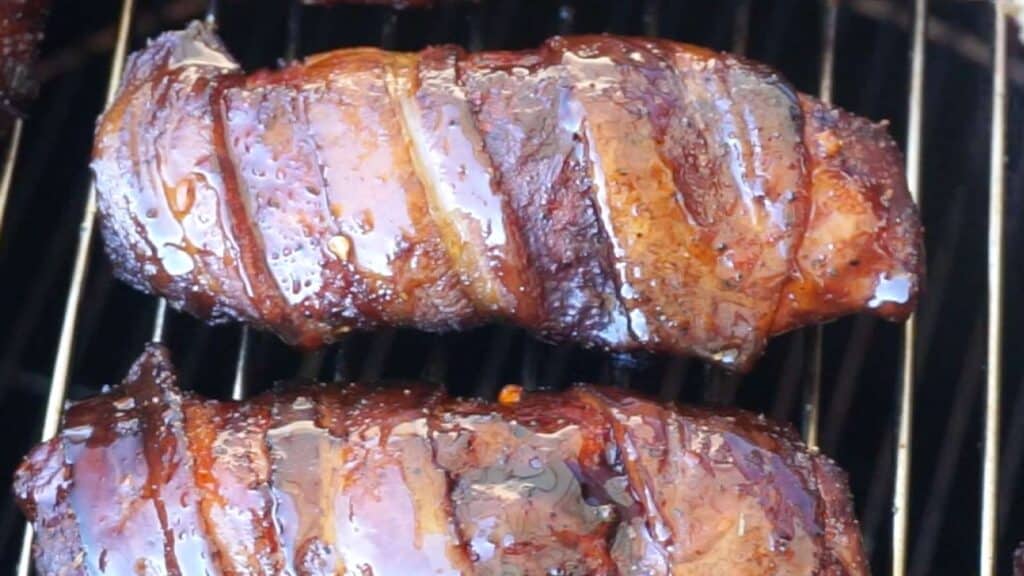 smoked ribs wrapped in bacon.