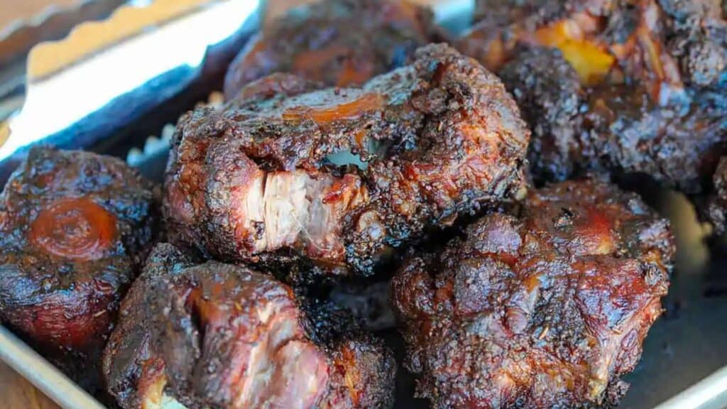 Barbecued oxtails on pan.