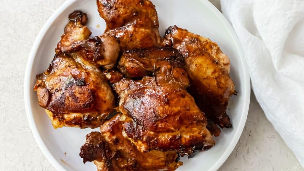 griddled teriyaki chicken thighs on a white plate