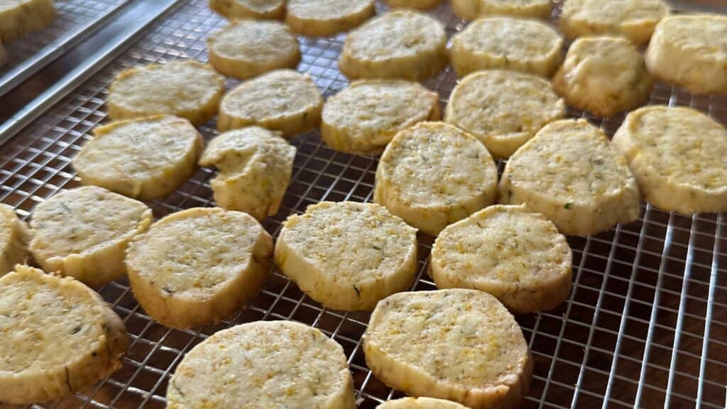Dandelion cookies cooling on a rack.