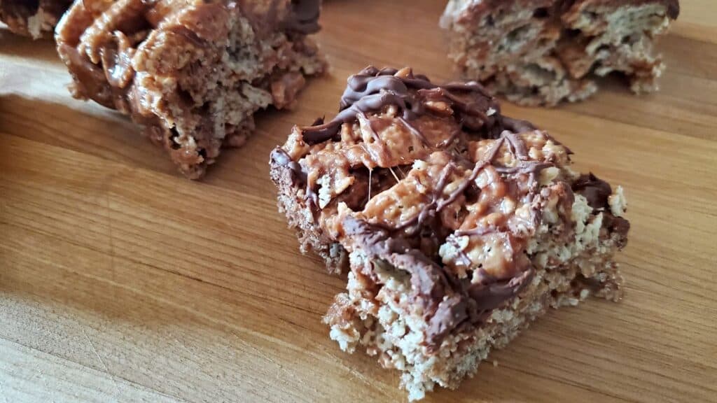 Image shows Double chocolate peppermint cereal bars on a wooden background.