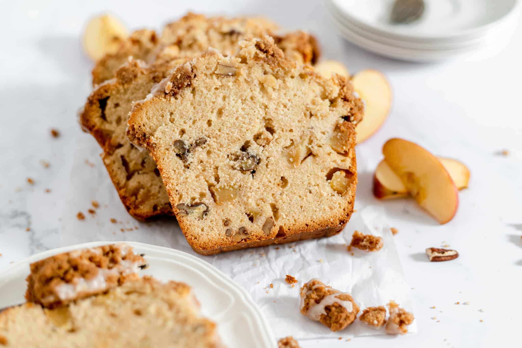 Slices of Dutch apple bread with big chunks of apple.