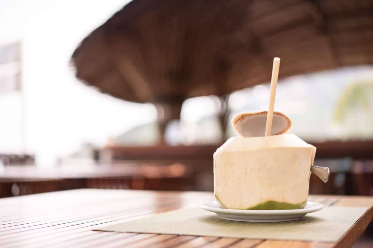 Fresh coconut at the tropical resort beach bar..