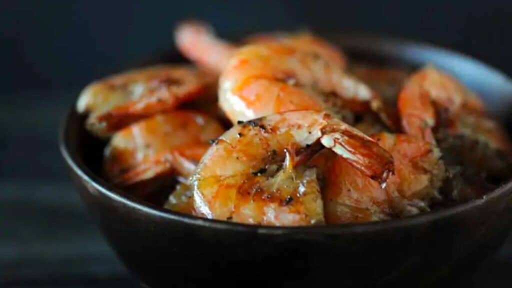 Bowl of shrimp with peels on.