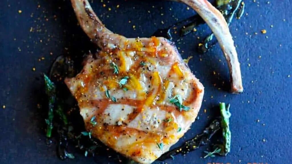 Tomahawk pork chops with orange marmalade glaze.