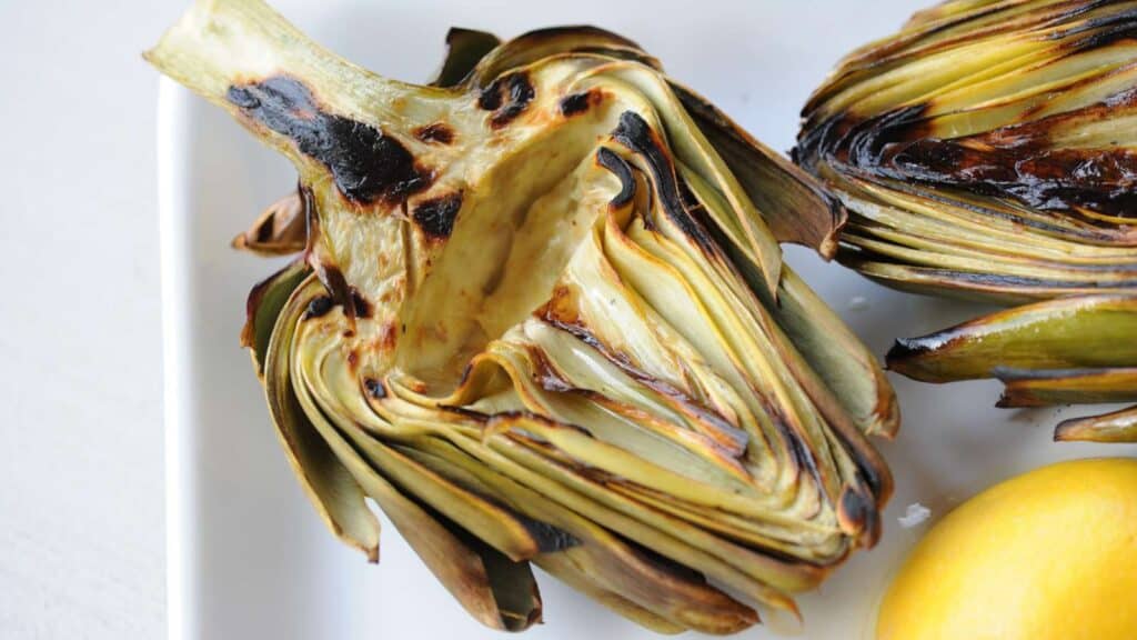 Grilled artichoke half.