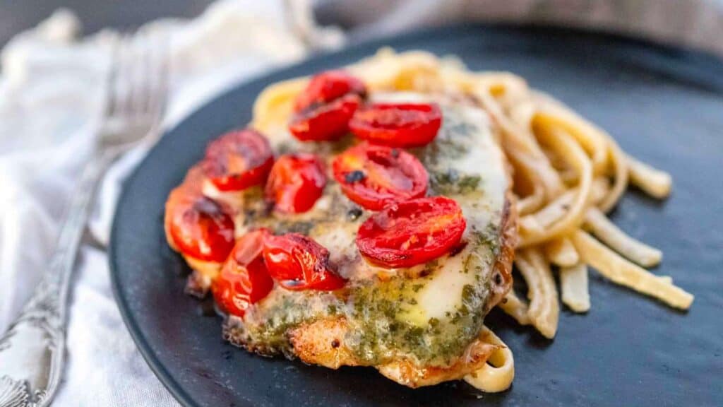 grilled chicken margherita on fettucine.