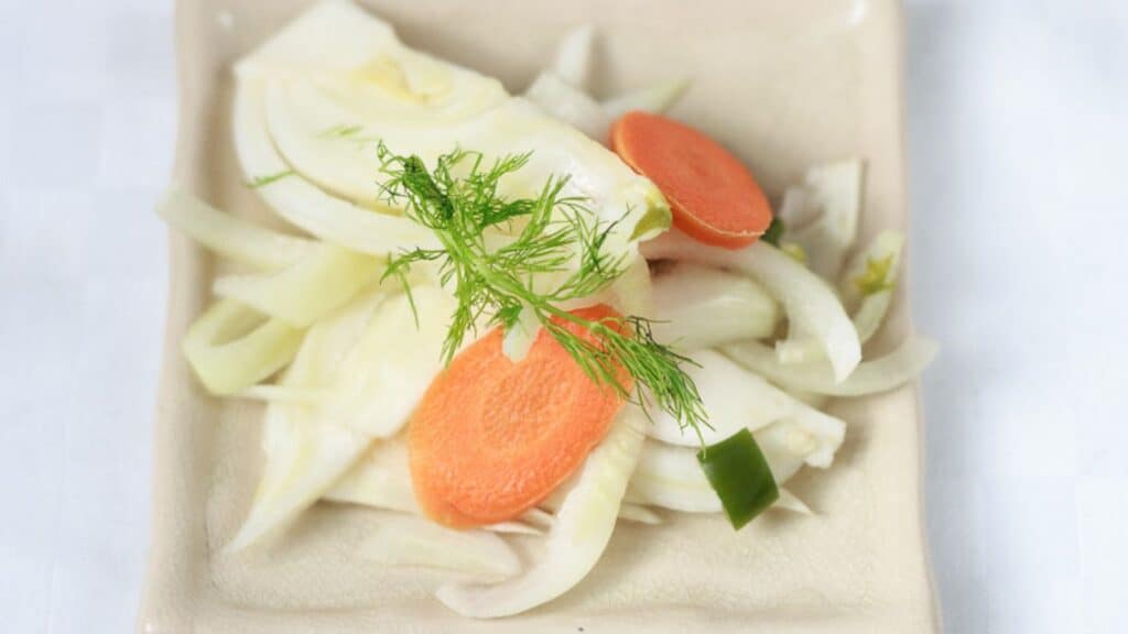 Mexican pickles on a square plate.