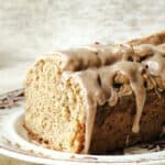 Iced Oatmeal bread on a brown and white plate.