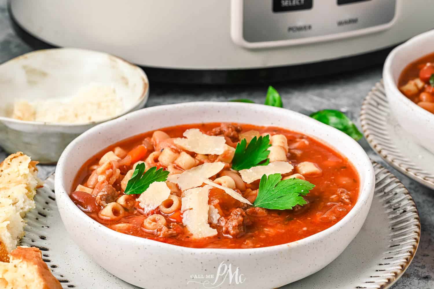 Two bowls of Copycat Pasta e Fagioli Soup in front of an instant pot.