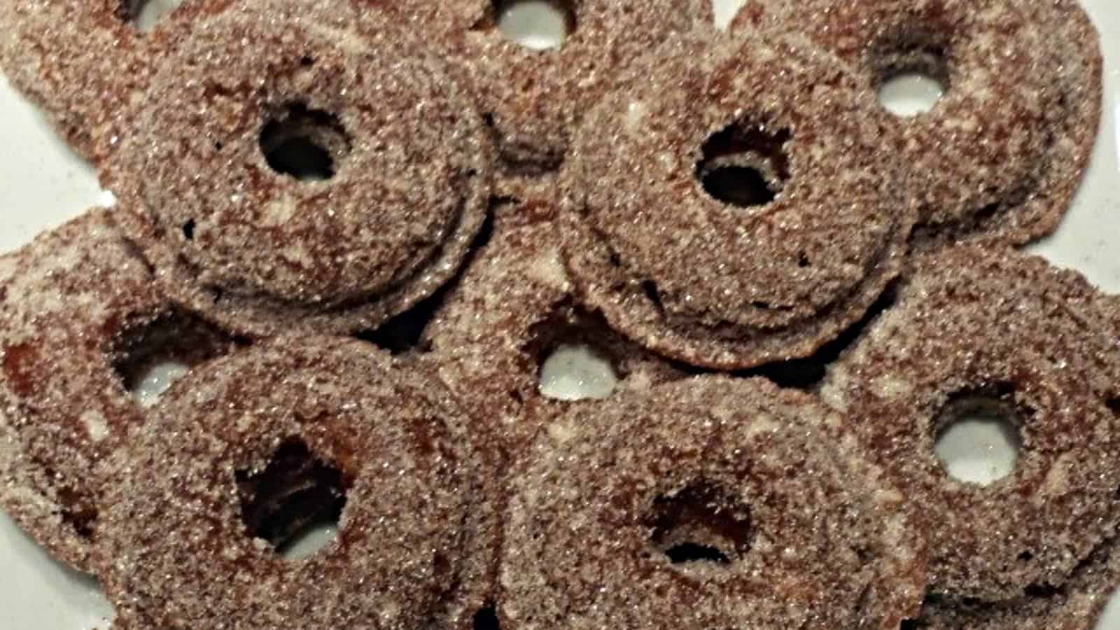 Overhead of a stack of baked apple cider donuts.