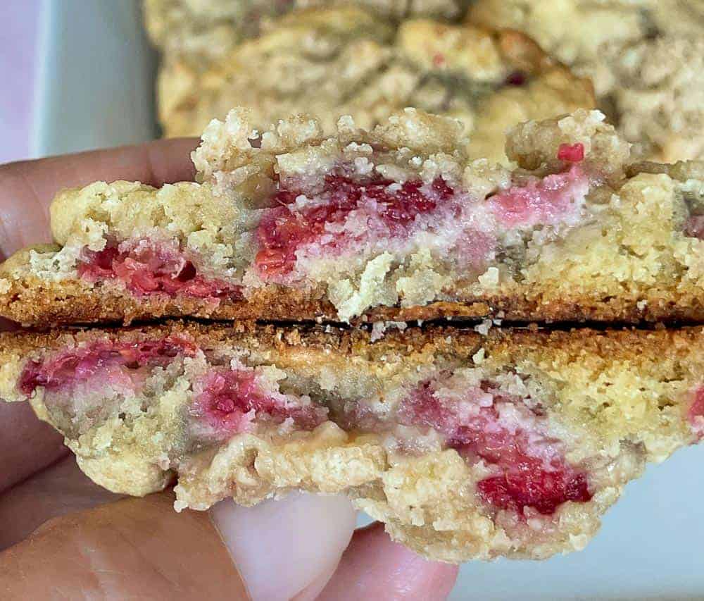 Two halves of a raspberry cookie.