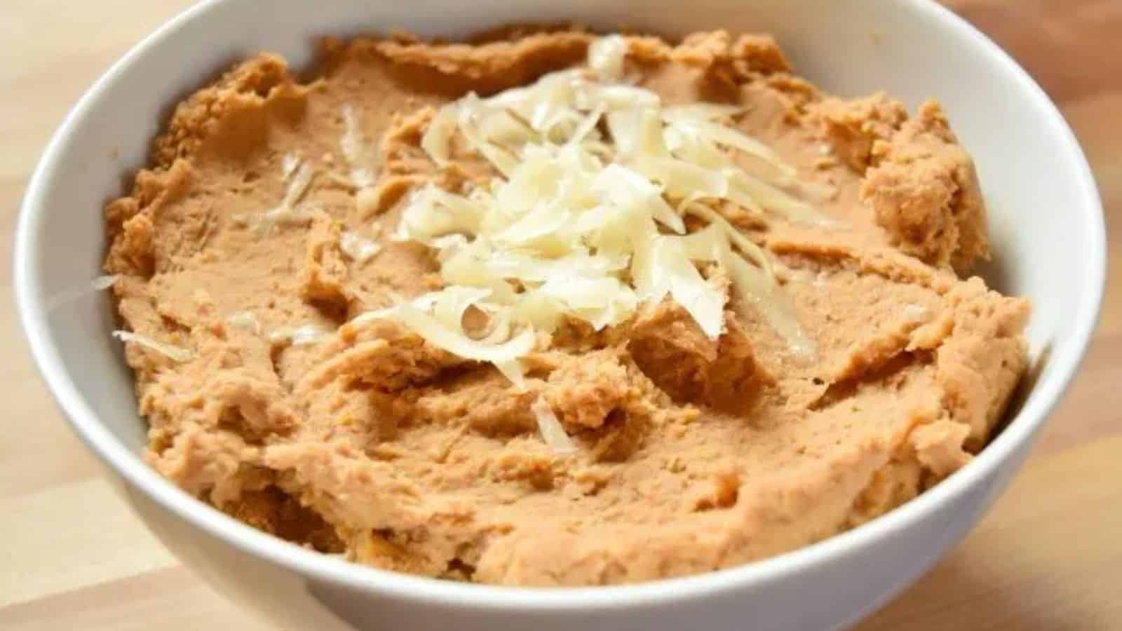 Image shows a bowl of Refried Beans up close.