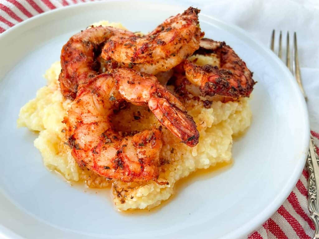 Spicy shrimp on a scoop of grits.