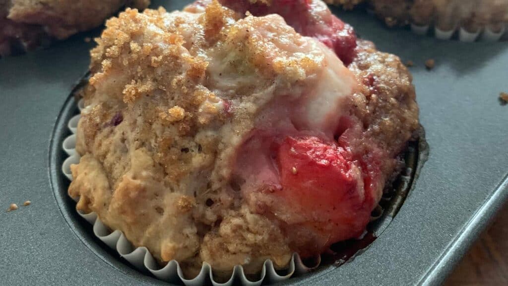 Strawberry rhubarb muffin in pan.
