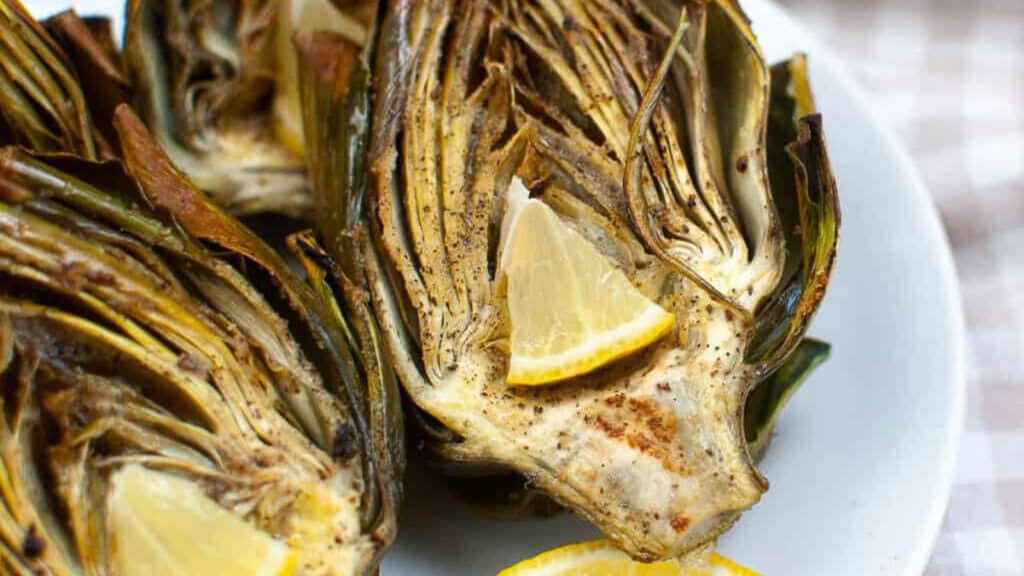 air fried artichokes on a white plate.