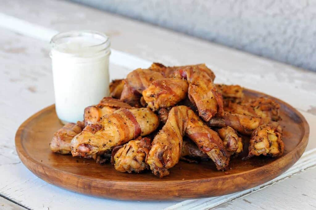 Platter of bacon-wrapped chicken wings.