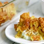 Piece of chicken and waffle casserole on a plate.