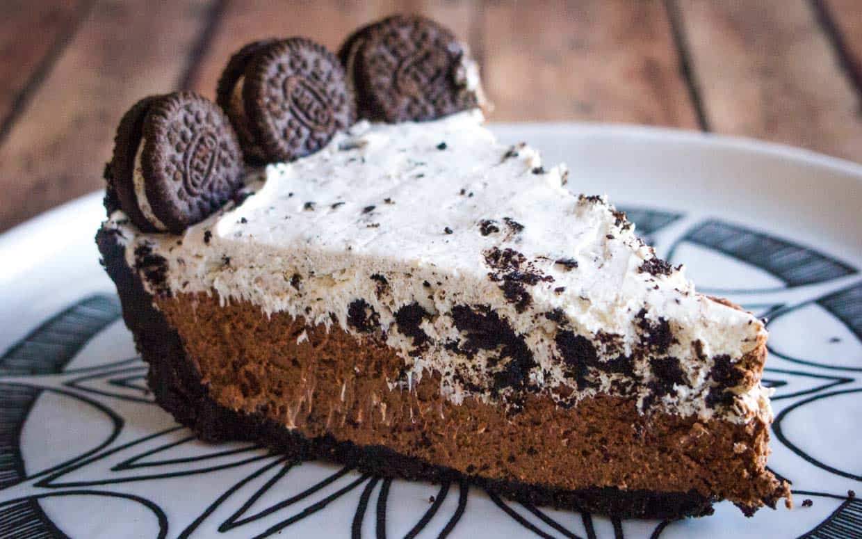 Chocolate pie with cookies and cream layer topped with mini oreos.