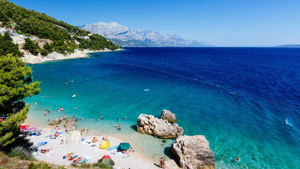 A beach in Croatia with bright blue water.