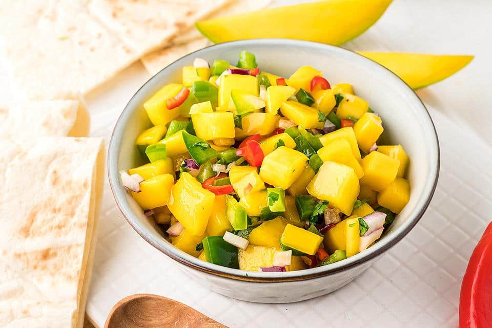 A bowl with homemade mango salsa.